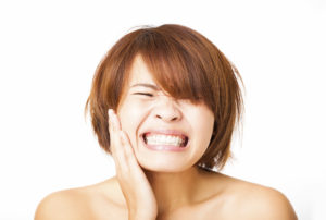closeup young Woman having toothache
